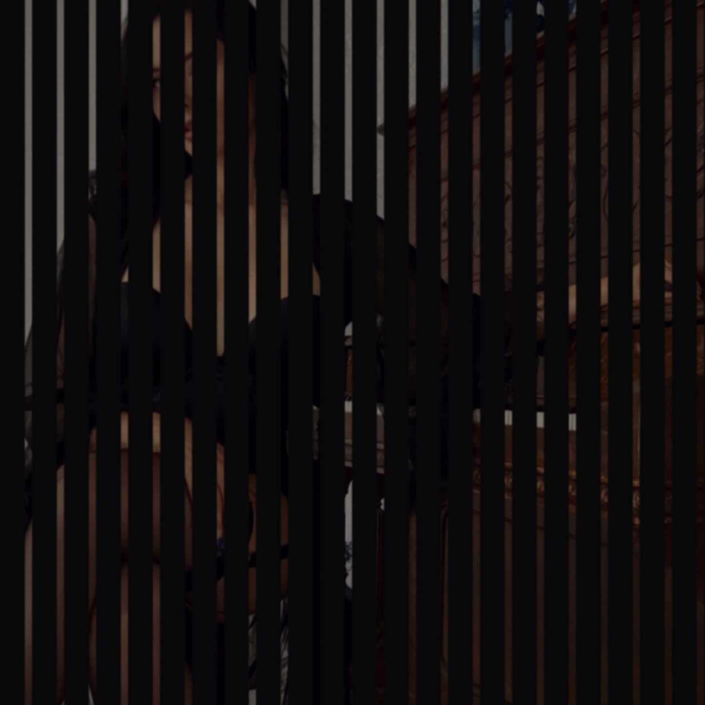 The August Set — glimpsed through a slatted door